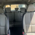 KIA Grand Sedona with Chauffeur Service